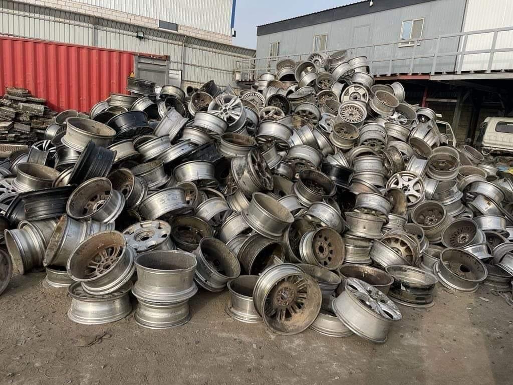 Aluminum wheel scrap piled in a yard