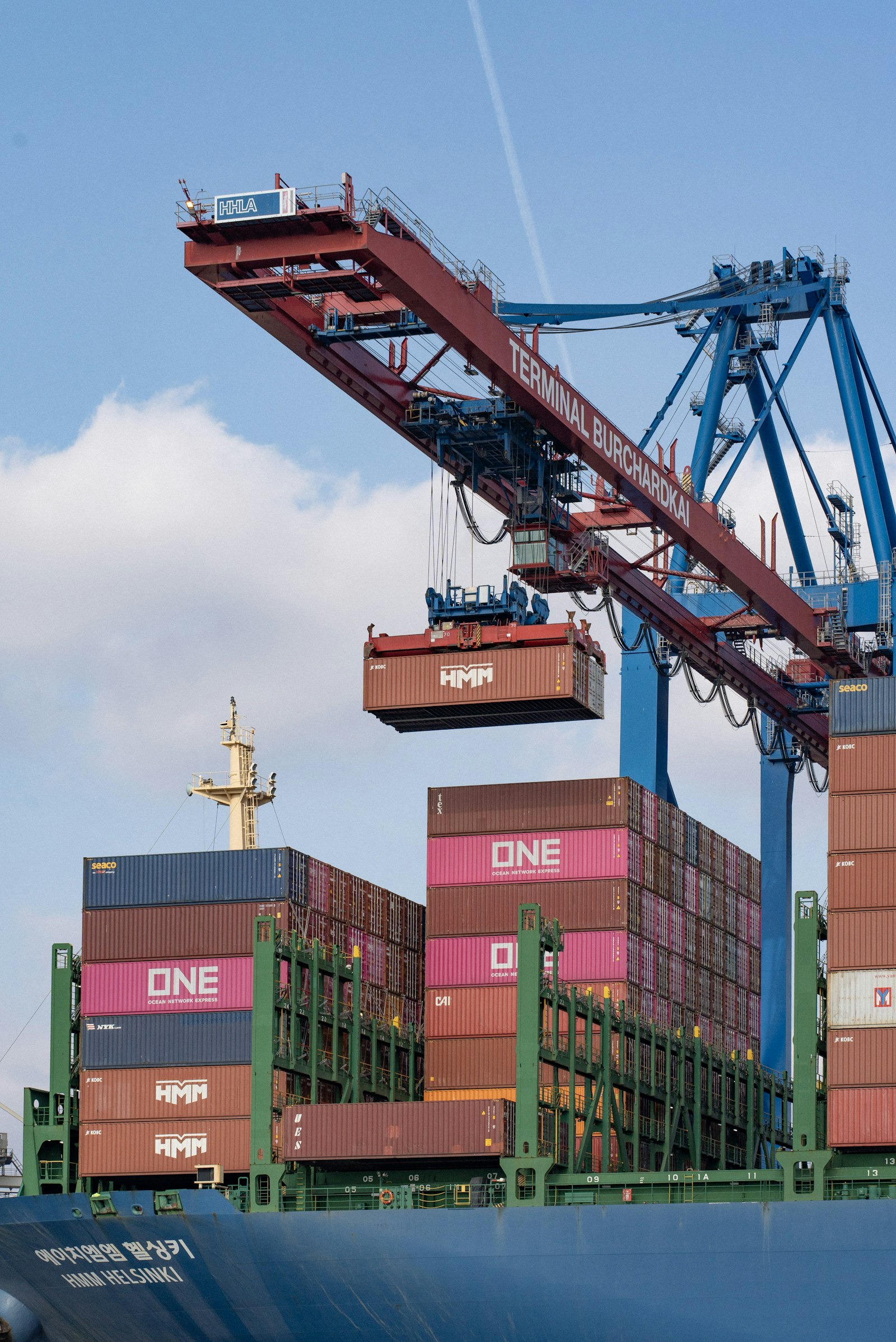 Container being loaded onto a vessel at port