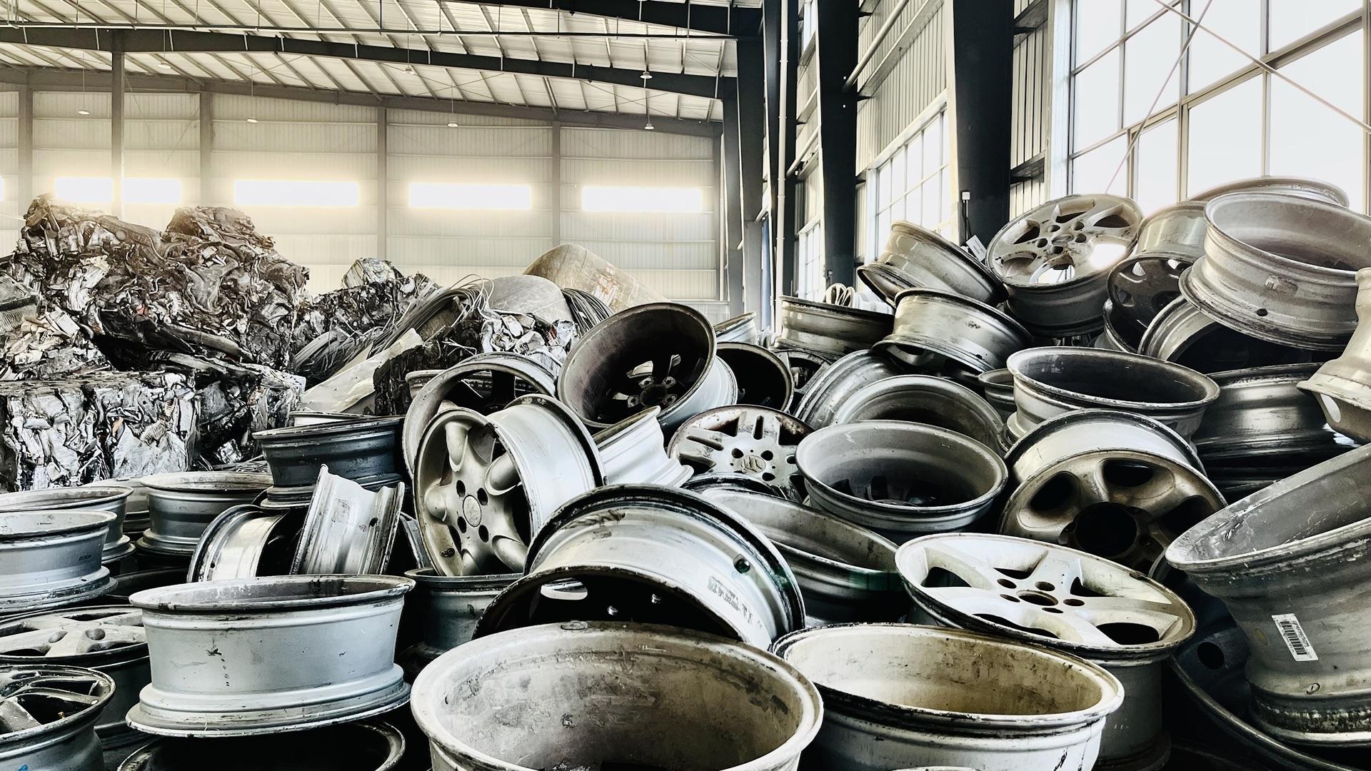 Sorted aluminum wheel scrap and materials stored at a warehouse facility